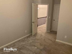 Jefferson house for rent - an empty room with a hallway and a door to a bedroom