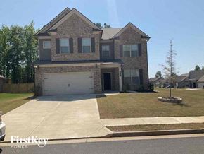 Jefferson house for rent - a brick house with a white garage door