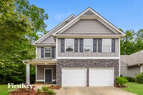 Canton house for rent - a house with a white garage door in front of it