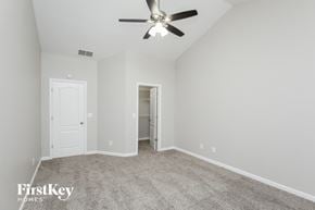 Winder house for rent - a bedroom with carpet and a ceiling fan