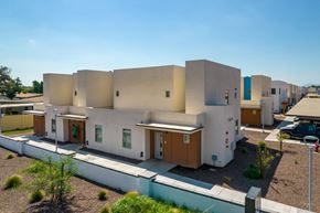 Glendale apartment for rent - A modern building with white walls and brown doors.