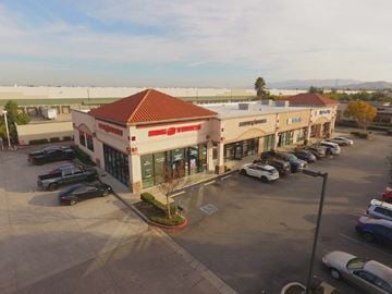 Chino apartment for rent - an aerial view of a parking lot with cars in front of a building