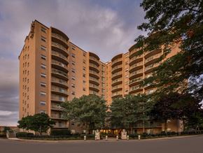 Quincy apartment for rent - a large apartment building with trees in front of it