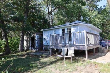 Lake Station house for rent - the cottage has a deck with a swing and a porch
