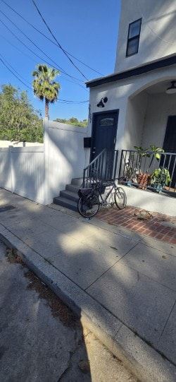 Los Angeles apartment for rent - A bicycle is parked on a sidewalk in front of a house.