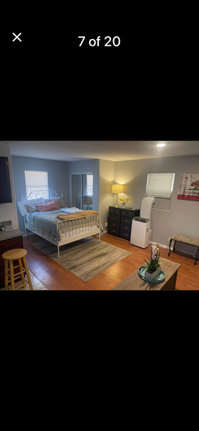 Los Angeles apartment for rent - A bedroom with a bed, nightstand, and a chair.