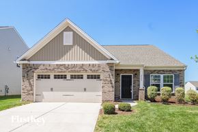 Winston-Salem house for rent - A two-story house with a garage and a driveway.