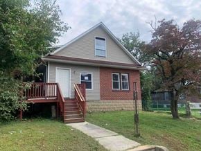 Stratford apartment for rent - A house with a red brick exterior and a white door.