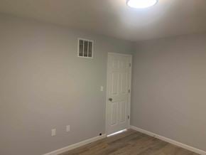 Stratford apartment for rent - A room with a white door and a light on the ceiling.