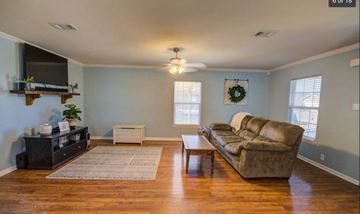 Duson house for rent - a living room with a couch and a television