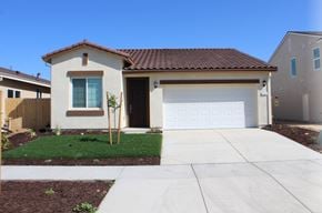 Merced house for rent - A house with a brown roof and a white garage door.