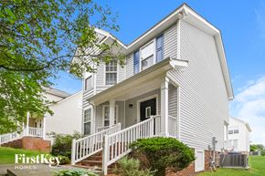 Raleigh house for rent - a white house with a porch and stairs