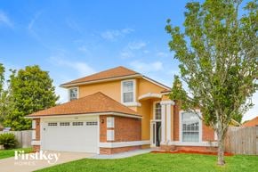 Orange Park house for rent - A house with a brown roof and a white garage door.