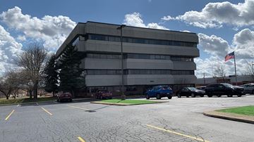 Solon apartment for rent - an office building with cars parked in a parking lot