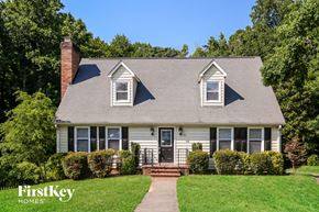 Winston-Salem house for rent - a white house with a gray roof and white windows