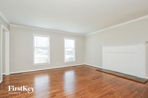 Winston-Salem house for rent - a living room with wood floors and white walls