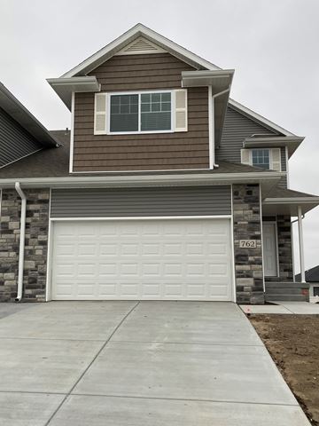Lincoln house for rent - a house with a white garage door in front of it