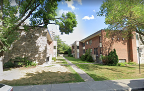 Saint-Laurent apartment for rent - A tree-lined street with a white car parked on the side.