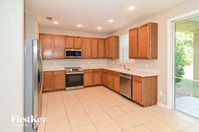Fernandina Beach house for rent - a large kitchen with wooden cabinets and stainless steel appliances