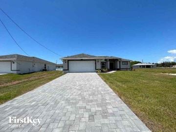 Cape Coral house for rent - a paved driveway in front of a house