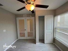 Cape Coral house for rent - a empty room with a ceiling fan and a door