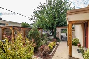 Farmington apartment for rent - a courtyard with a house and a tree