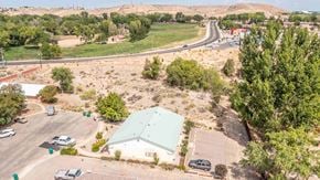 Farmington apartment for rent - an aerial view of a green roofed building with a highway in the background