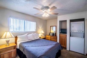 Farmington apartment for rent - a bedroom with a bed and a ceiling fan