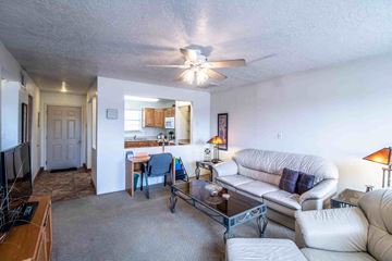 Farmington apartment for rent - a living room with a couch and a table