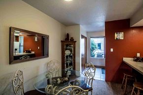 Farmington house for rent - a dining room with a glass table and chairs