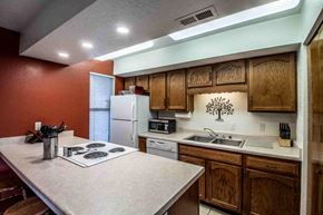 Farmington house for rent - a kitchen with a stove top oven and a sink