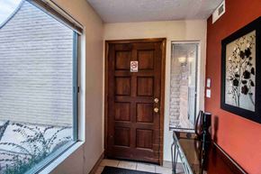 Farmington house for rent - the front door of a home with a large window and a wooden door
