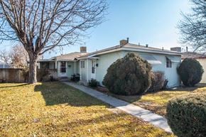 Farmington apartment for rent - a white house with a yard and a tree
