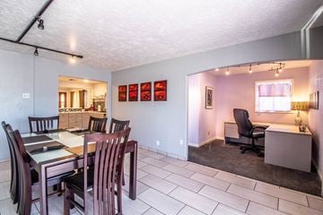 Farmington apartment for rent - a dining room and living room with a table and chairs
