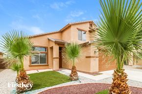 Buckeye house for rent - a house with palm trees in front of it