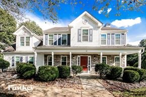Hiram house for rent - a white house with green shutters and a red door