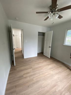 San Bernardino apartment for rent - a living room with a wood floor and a ceiling fan