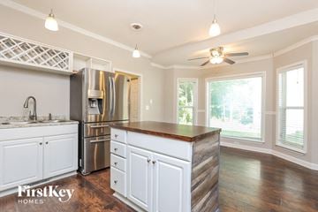 Antioch house for rent - a kitchen with white cabinets and a counter top
