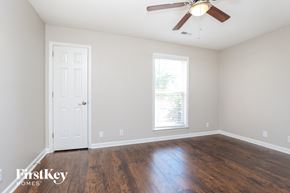 Antioch house for rent - a living room with hardwood floors and a ceiling fan