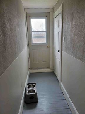 Stellarton apartment for rent - A hallway with a door and a window.