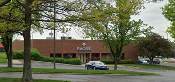 Overland Park apartment for rent - a parking lot with a car parked in front of a building