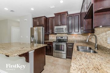 Jacksonville house for rent - a kitchen with granite counter tops and stainless steel appliances