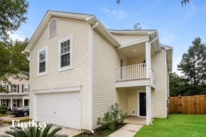 Ladson house for rent - A two-story house with a garage and a balcony.