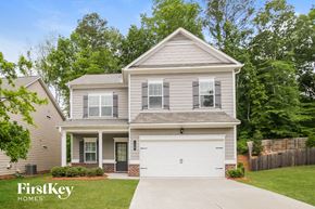 Canton house for rent - a white house with a white garage door