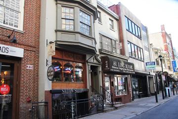 Philadelphia apartment for rent - a city street with buildings and a clock on the side of a building