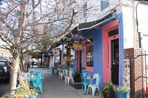 Philadelphia apartment for rent - a street with tables and chairs outside of a building
