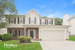 Concord house for rent - A two-story house with a garage is for sale.