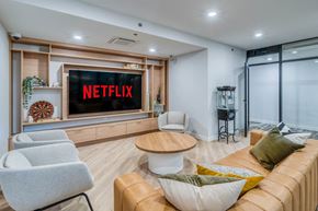 Calgary apartment for rent - A living room with a Netflix screen on the wall.