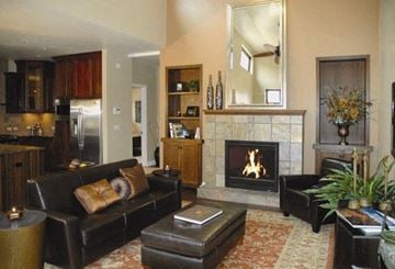 Manitou Springs apartment for rent - a living room with leather furniture and a fireplace