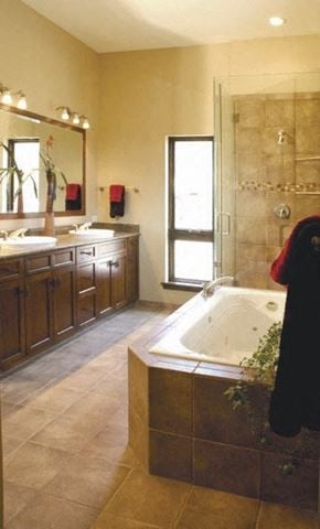 Manitou Springs apartment for rent - a large bathroom with a tub and two sinks